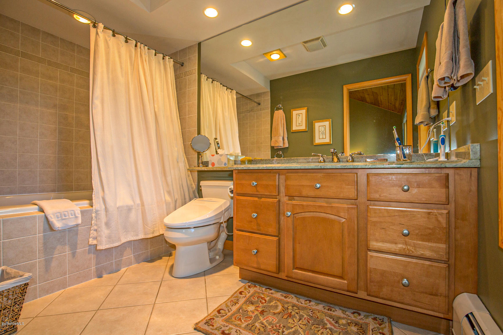 358 Harrington Road Otis, MA 01253 - Photo 26 of 52 a bathroom with a toilet sink and mirror