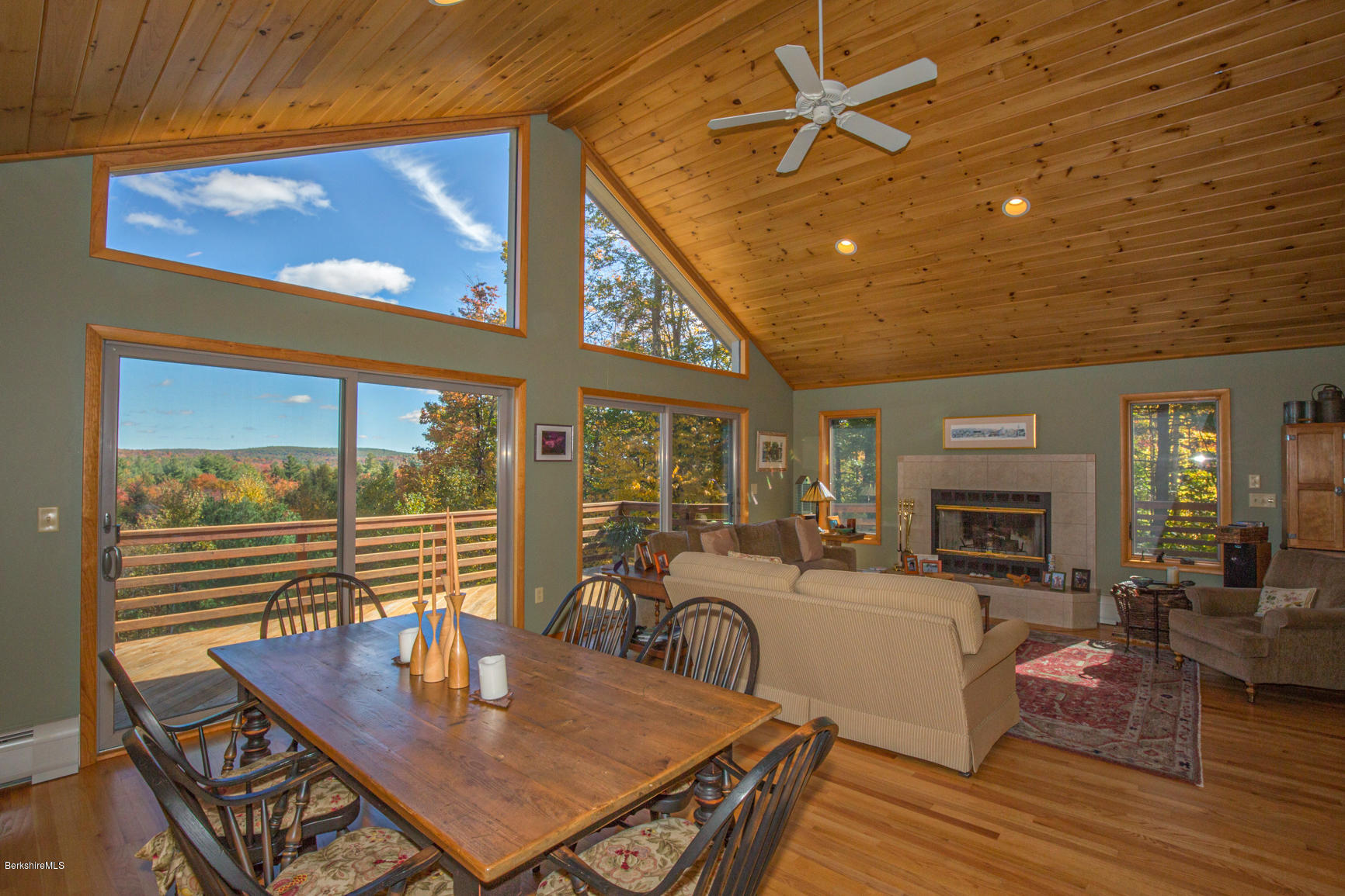 358 Harrington Road Otis, MA 01253 - Photo 4 of 52 a living room with furniture a fireplace and a table