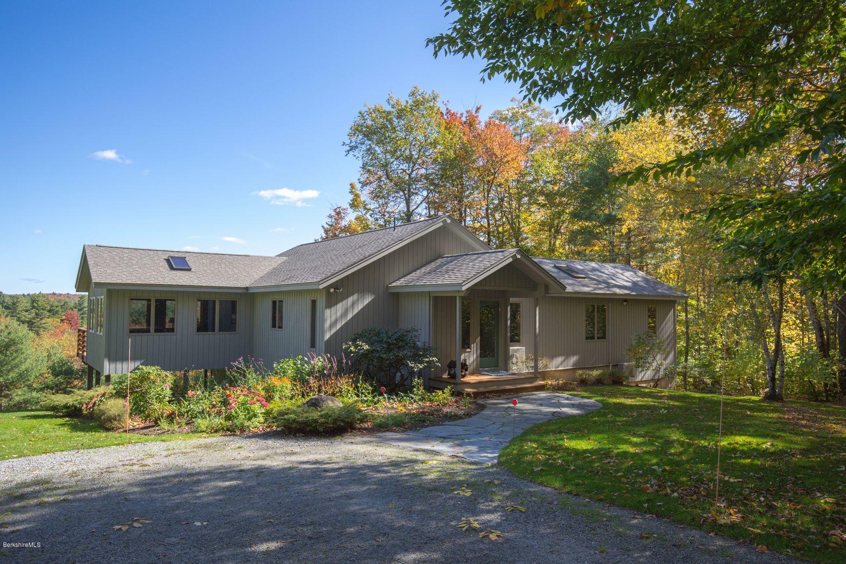 358 Harrington Road Otis, MA 01253 - Photo 47 of 52 a front view of a house with garden
