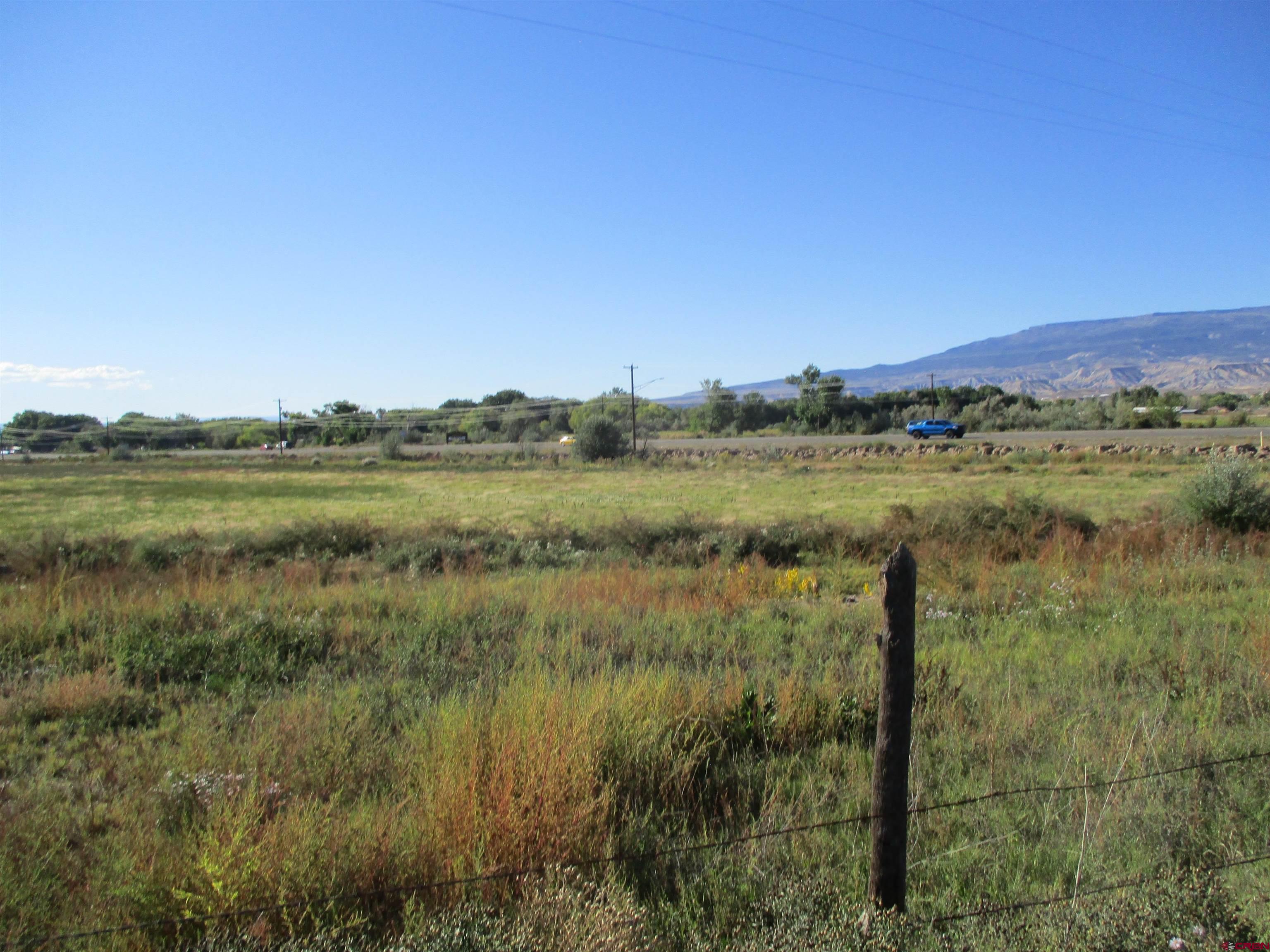 665 1725th Road Delta, CO 81416 - Photo 17 of 19 a view of a lake with a mountain in the background
