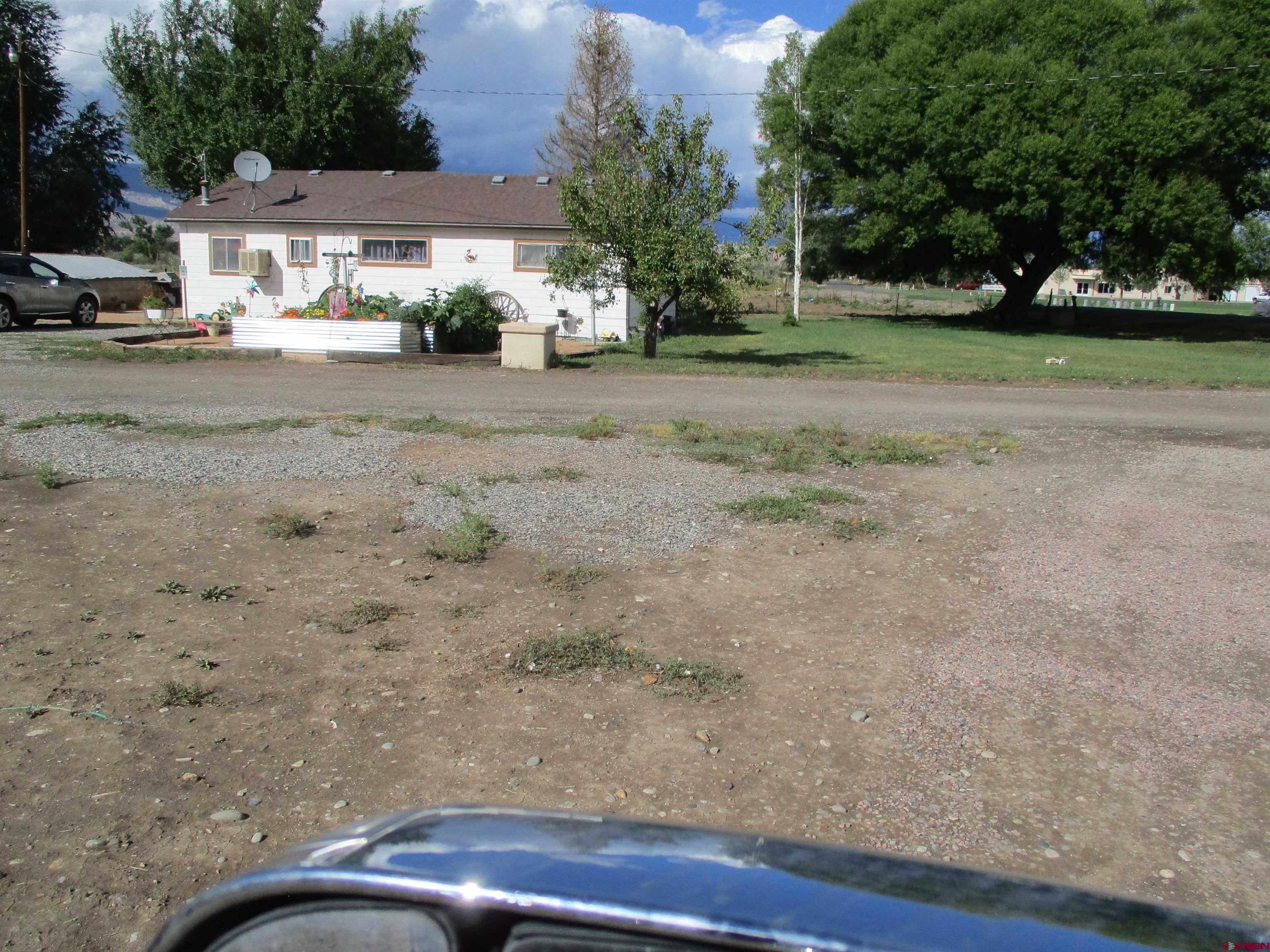 665 1725th Road Delta, CO 81416 - Photo 2 of 19 a view of a house with backyard