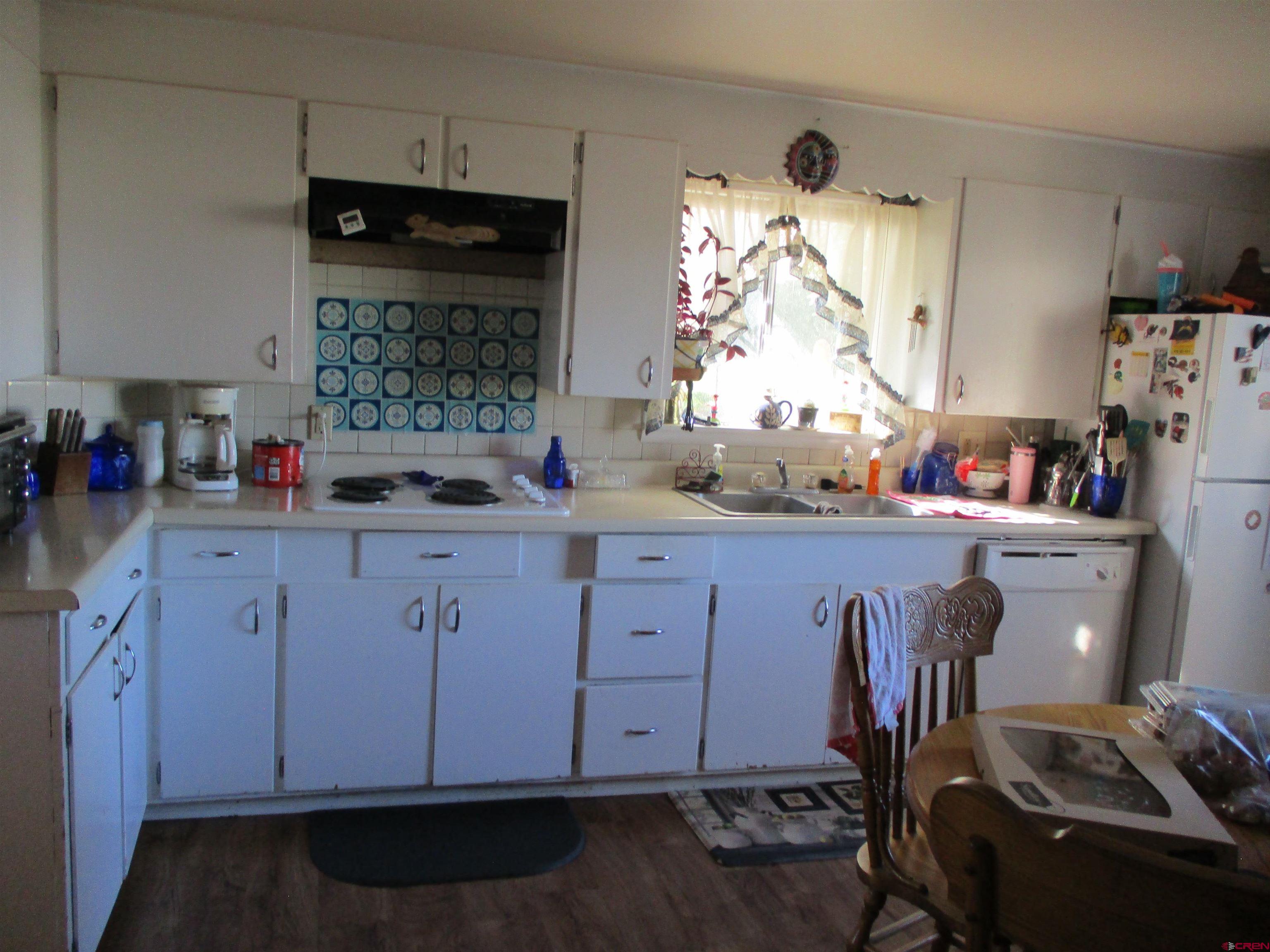 665 1725th Road Delta, CO 81416 - Photo 4 of 19 a kitchen with a sink and cabinets