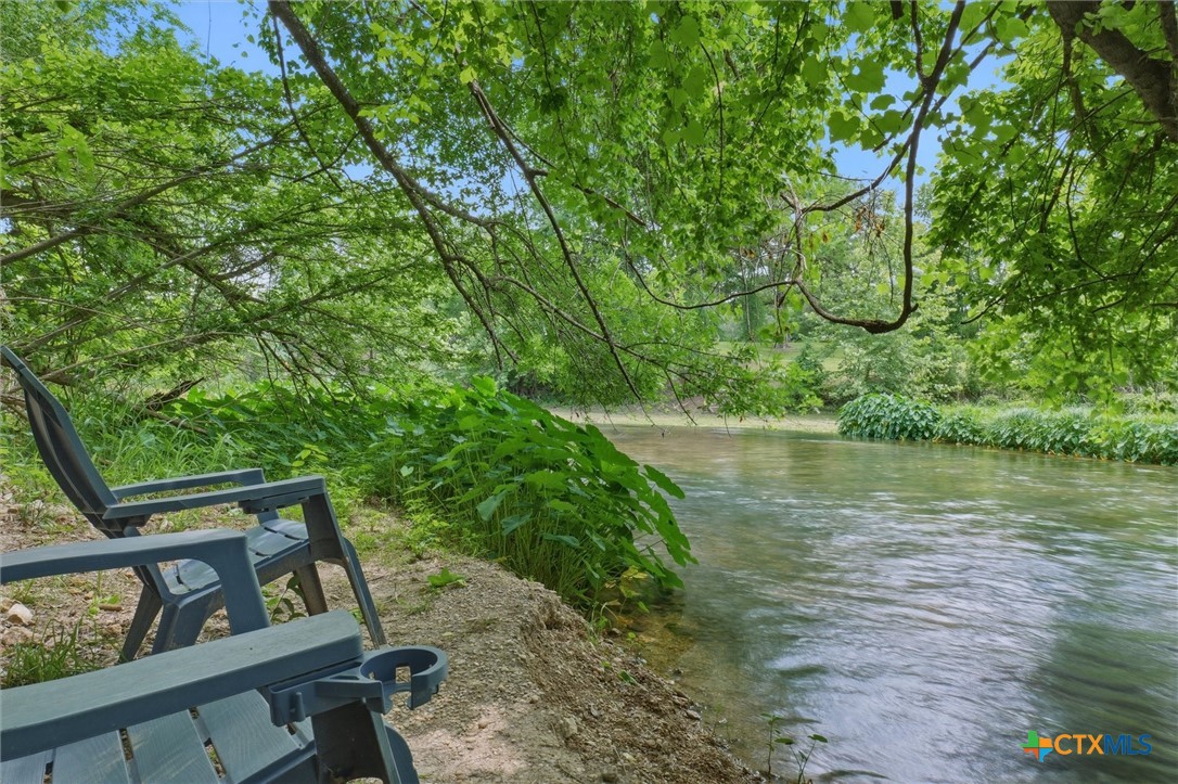 541 Martindale Falls Road Martindale, TX 78655 - Photo 44 of 44 Peaceful shaded river access area beneath mature trees along the San Marcos River