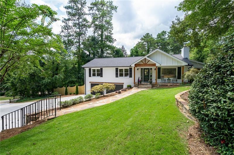 3130 New Paces Ferry Road Southeast Atlanta, GA 30339 - Photo 1 of 1 a house with swimming pool in front of it