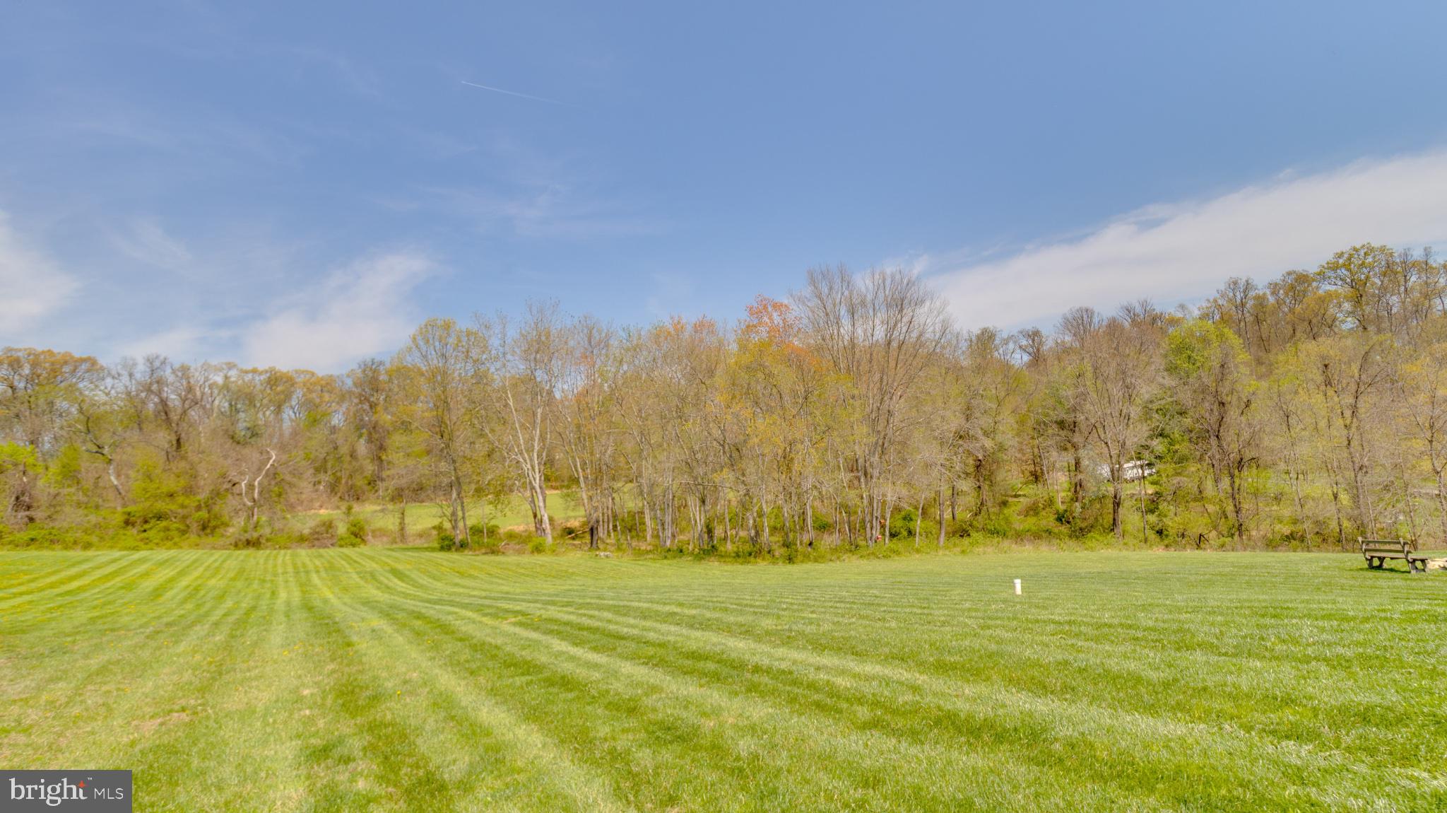 1296 Macton Road Street, MD 21154 - Photo 9 of 34 Lush green fields meet serene woodlands.
