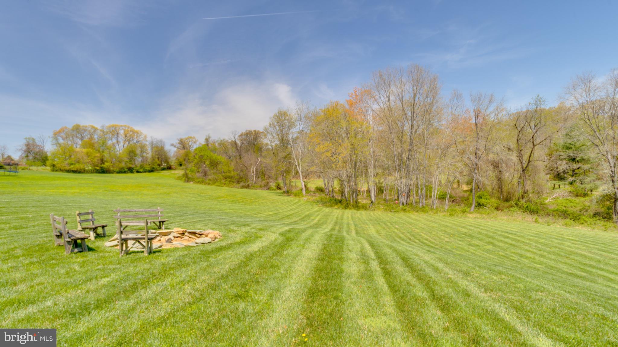 1296 Macton Road Street, MD 21154 - Photo 10 of 34 Serene landscape with fire pit area.
