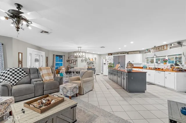a kitchen with stainless steel appliances a sink and a refrigerator