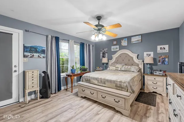 a large white kitchen with a large window