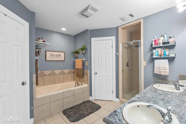 a large kitchen with a large window and stainless steel appliances