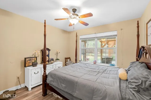 a bathroom with a granite countertop tub sink and mirror