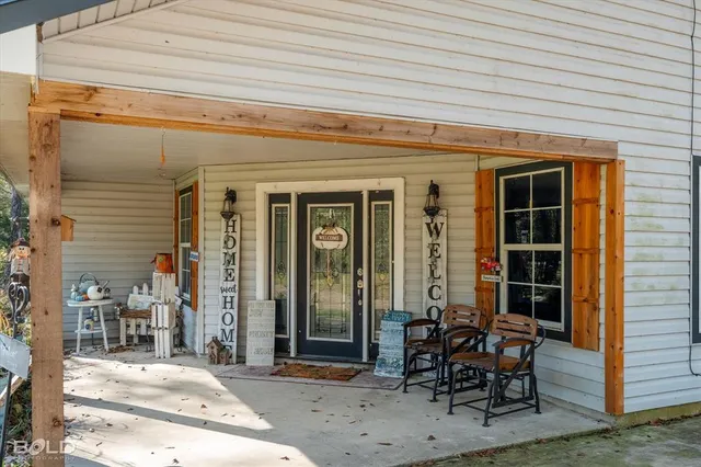 a view of a dining room with furniture wooden floor and chandelier