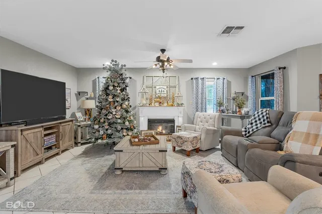 a living room with furniture and a christmas tree