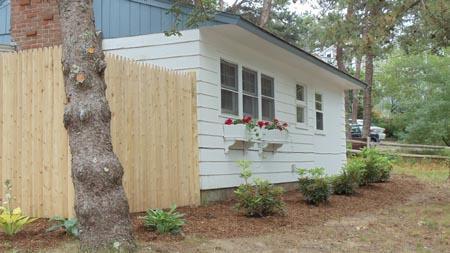 15 Massasoit Road, Unit 2 Wellfleet, MA 02667 - Photo 1 of 11 a view of house with backyard and garden