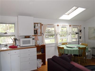 15 Massasoit Road, Unit 2 Wellfleet, MA 02667 - Photo 6 of 11 a dining room with furniture and a window