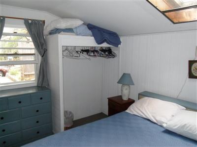 15 Massasoit Road, Unit 2 Wellfleet, MA 02667 - Photo 8 of 11 a bedroom with a bed and a window