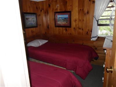 15 Massasoit Road, Unit 2 Wellfleet, MA 02667 - Photo 9 of 11 a bedroom with a bed and a window