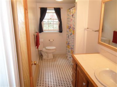 15 Massasoit Road, Unit 2 Wellfleet, MA 02667 - Photo 10 of 11 a bathroom with a sink toilet and shower