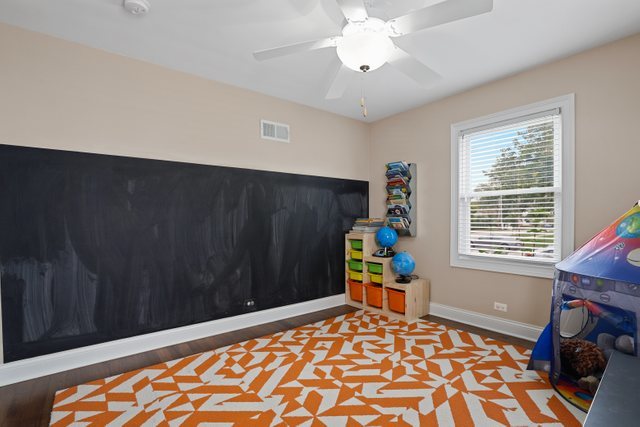 934 Spring Road Elmhurst, IL 60126 - Photo 12 of 27 a bedroom with a bed and a window