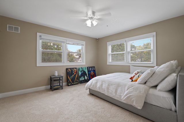 934 Spring Road Elmhurst, IL 60126 - Photo 21 of 27 a bedroom with a bed and a window
