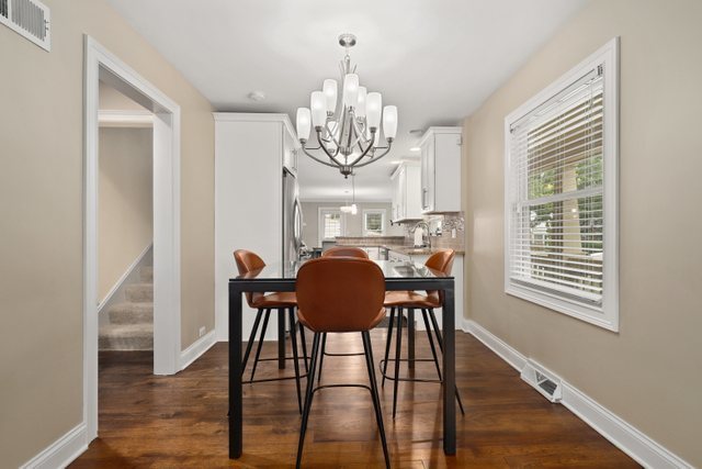 934 Spring Road Elmhurst, IL 60126 - Photo 5 of 27 a view of a dining room with furniture window and wooden floor
