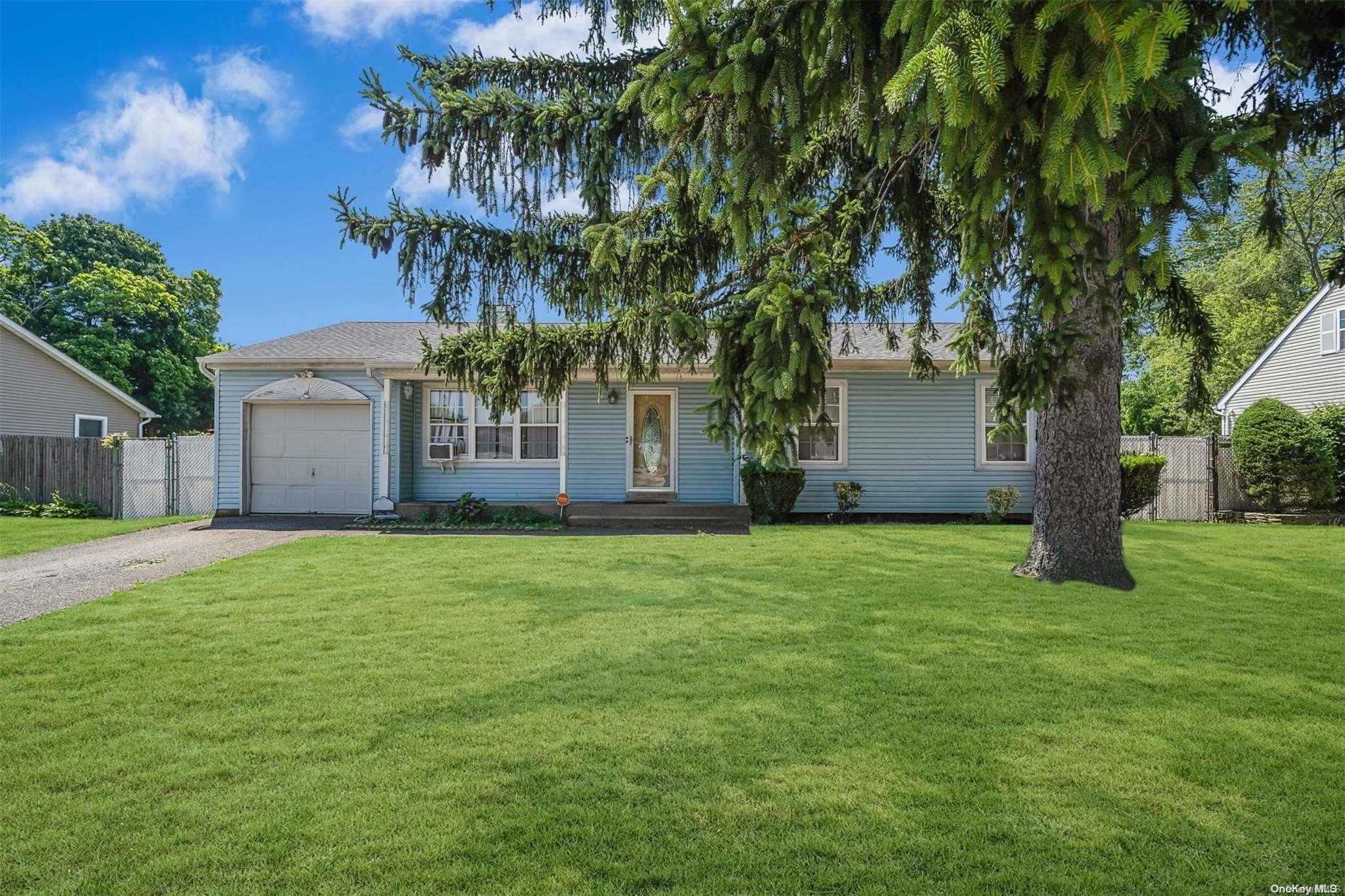 5 Pine Street Central Islip, NY 11722 - Photo 1 of 1 a front view of a house with a yard and garage