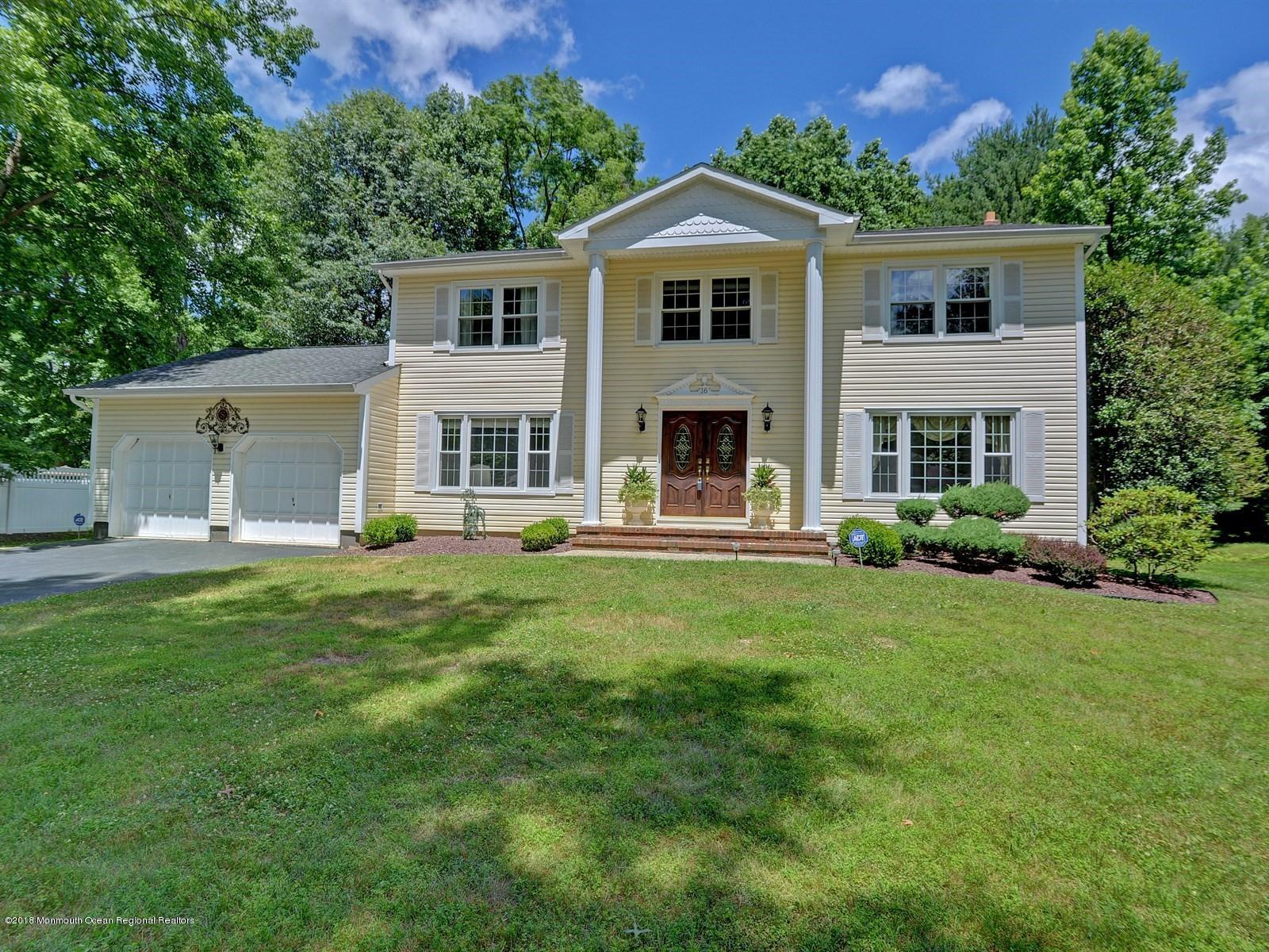 16 Canvasback Road Manalapan, NJ 07726 - Photo 1 of 26 a front view of a house with a yard