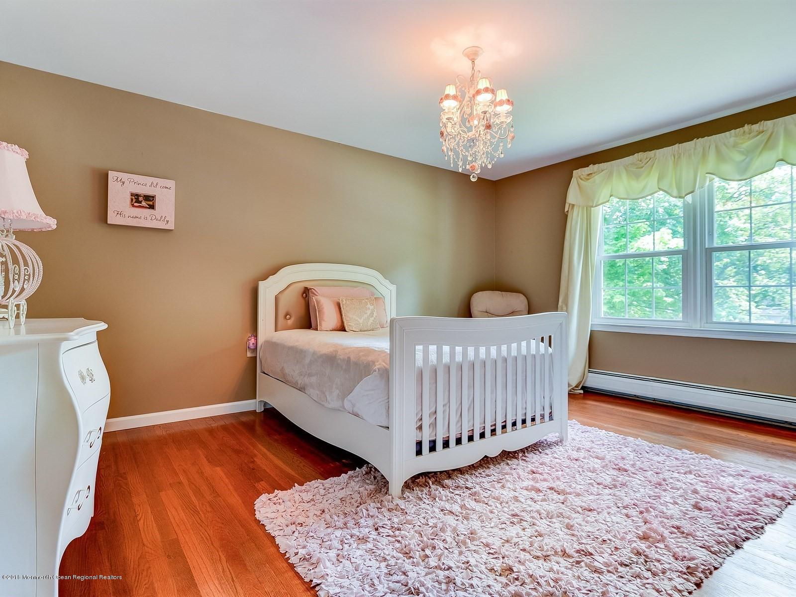 16 Canvasback Road Manalapan, NJ 07726 - Photo 19 of 26 a bedroom with a bed and a window