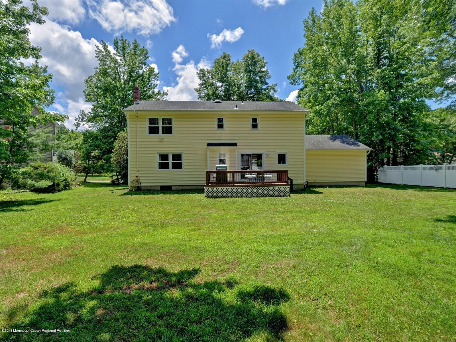 16 Canvasback Road Manalapan, NJ 07726 - Photo 26 of 26 a view of a back yard of the house with a big yard