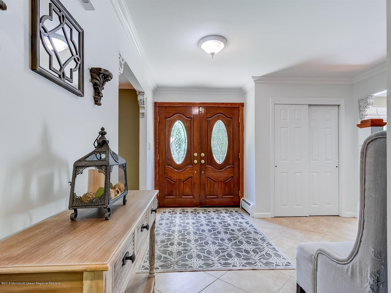 16 Canvasback Road Manalapan, NJ 07726 - Photo 3 of 26 a view of an entryway with wooden floor