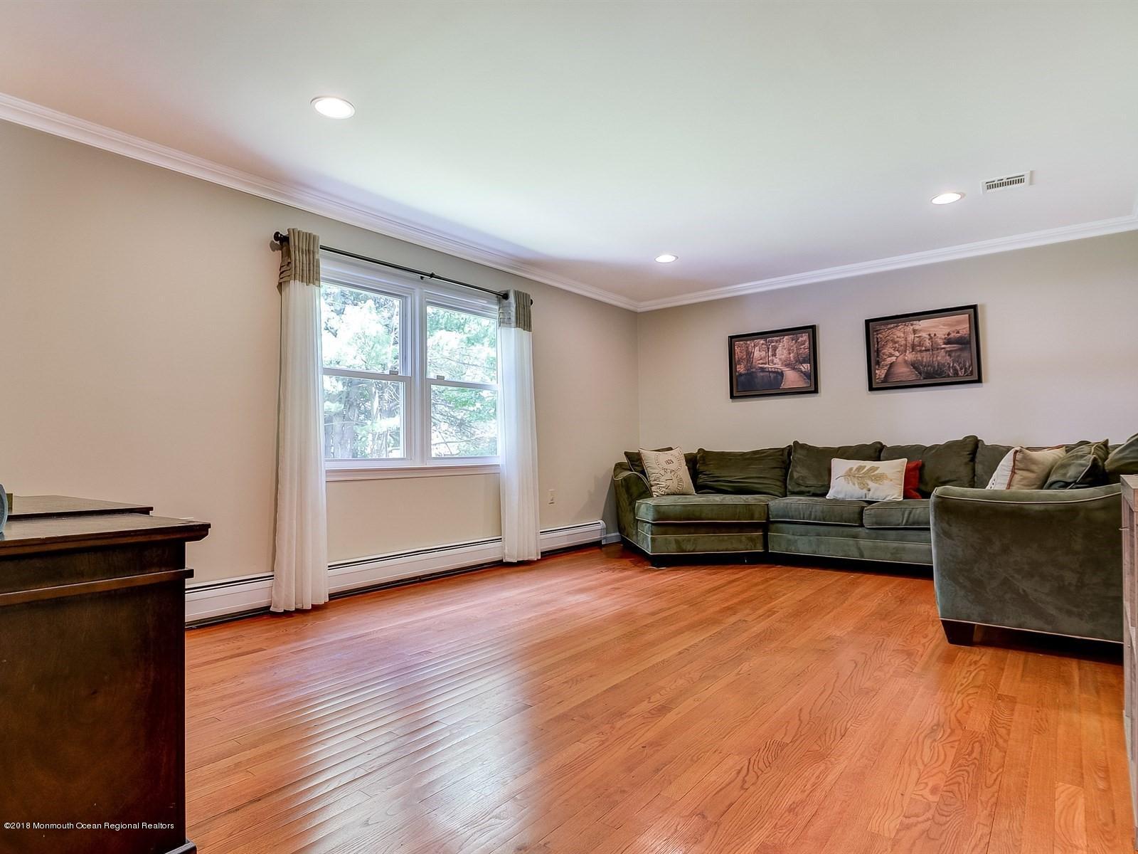 16 Canvasback Road Manalapan, NJ 07726 - Photo 8 of 26 a living room with furniture and a window