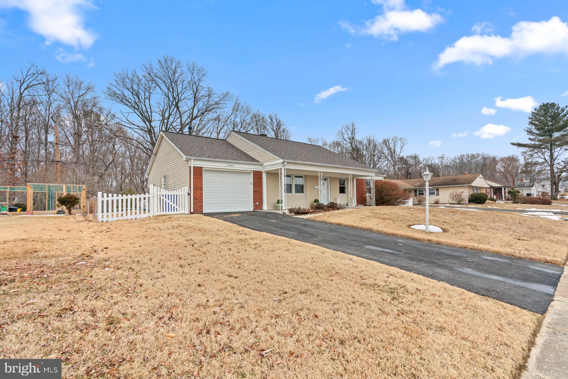 12202 Rustic Hill Drive Bowie, MD 20715 - Photo 2 of 34 a view of house with a yard