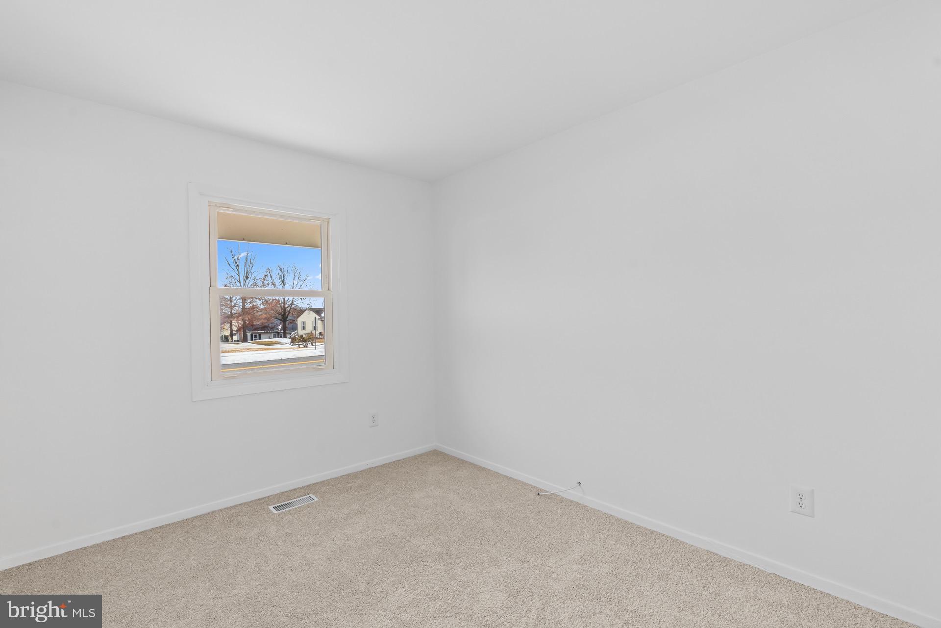 12202 Rustic Hill Drive Bowie, MD 20715 - Photo 24 of 34 an empty room with a window