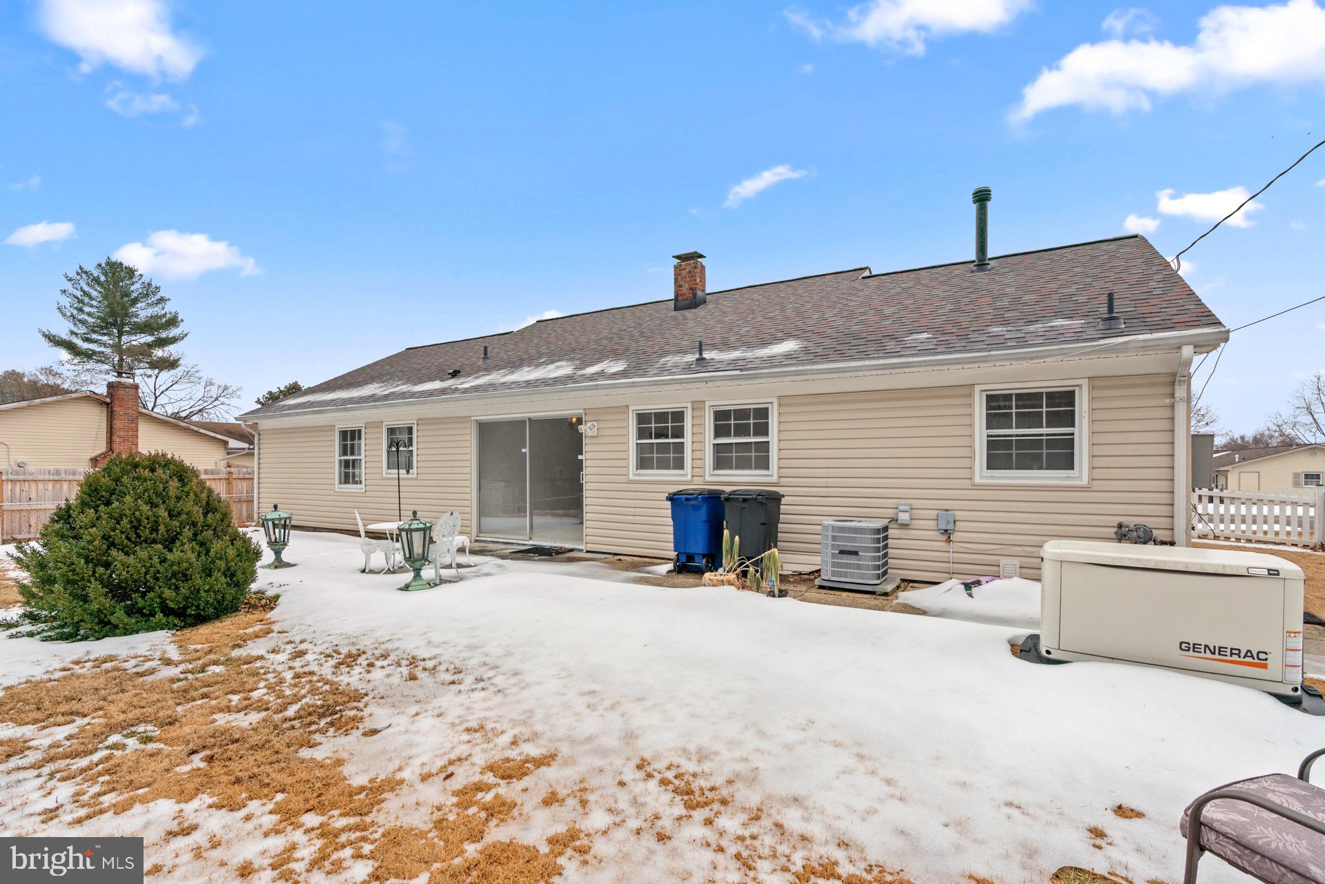 12202 Rustic Hill Drive Bowie, MD 20715 - Photo 31 of 34 a view of a house with a patio