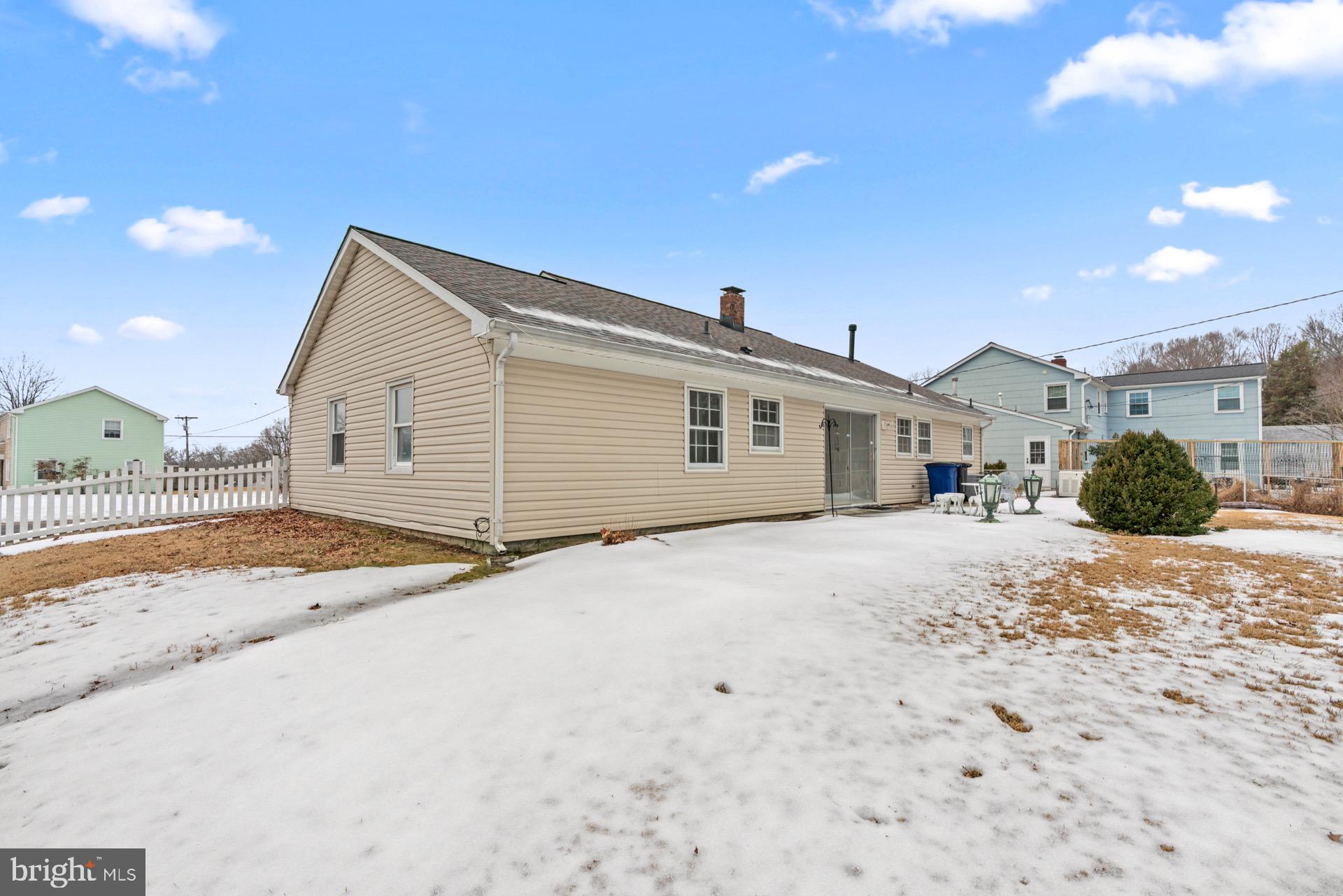 12202 Rustic Hill Drive Bowie, MD 20715 - Photo 34 of 34 a view of a house with a patio