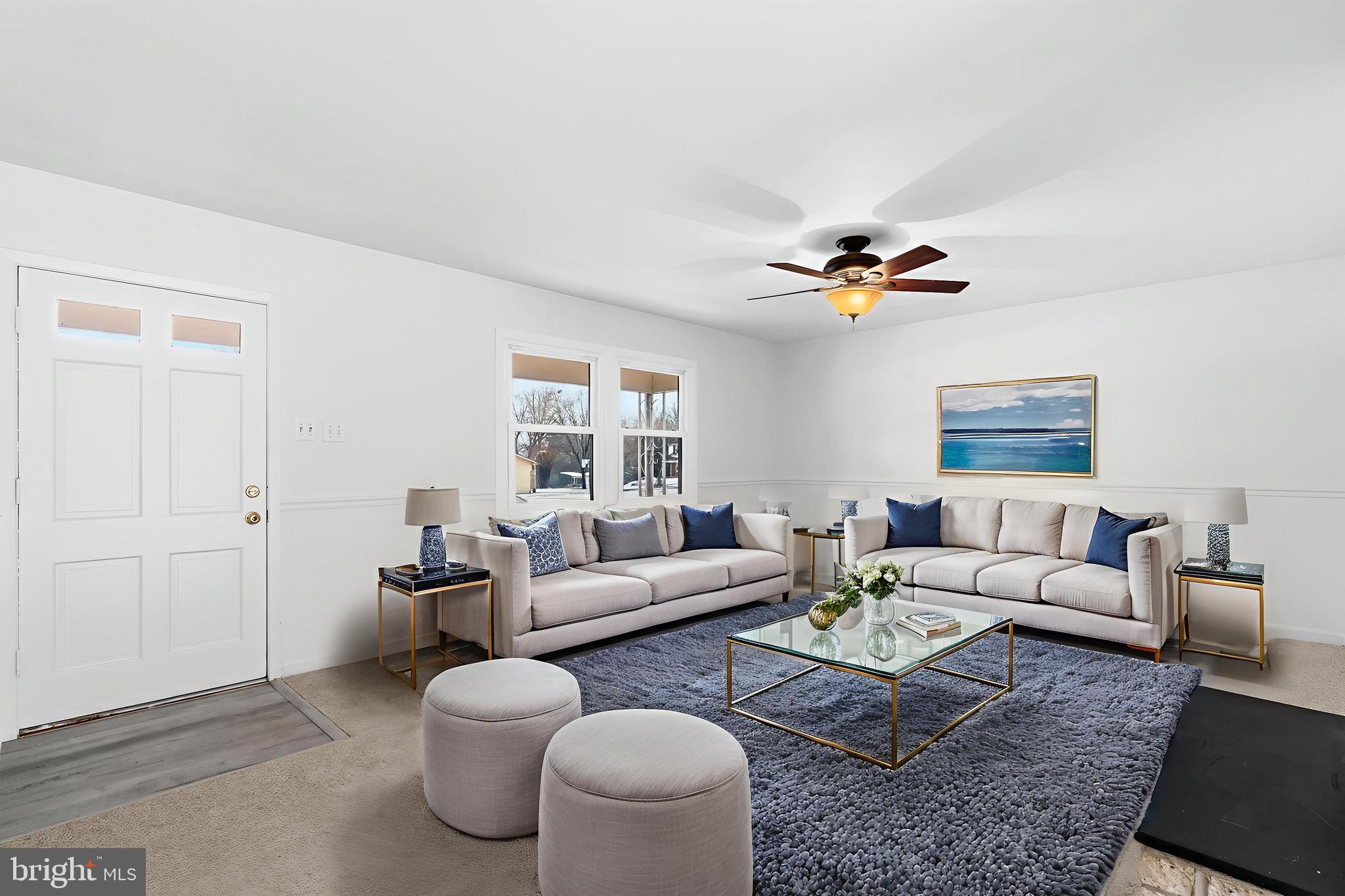 12202 Rustic Hill Drive Bowie, MD 20715 - Photo 5 of 34 a living room with furniture and a large window