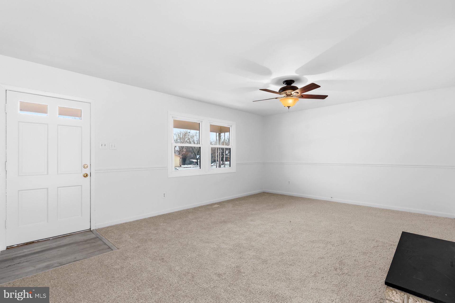 12202 Rustic Hill Drive Bowie, MD 20715 - Photo 7 of 34 a view of an empty room with a window