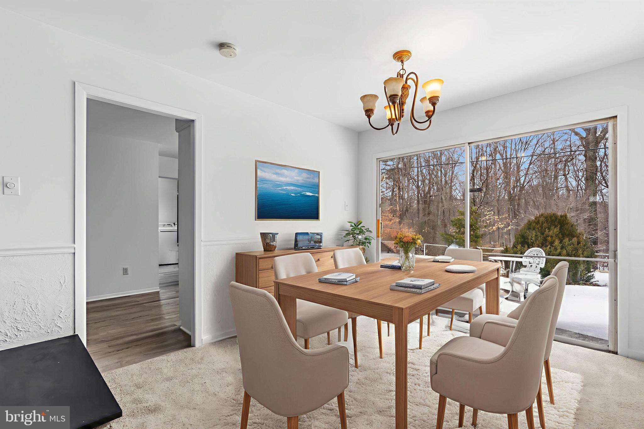 12202 Rustic Hill Drive Bowie, MD 20715 - Photo 9 of 34 a view of a dining room with furniture window and outside view