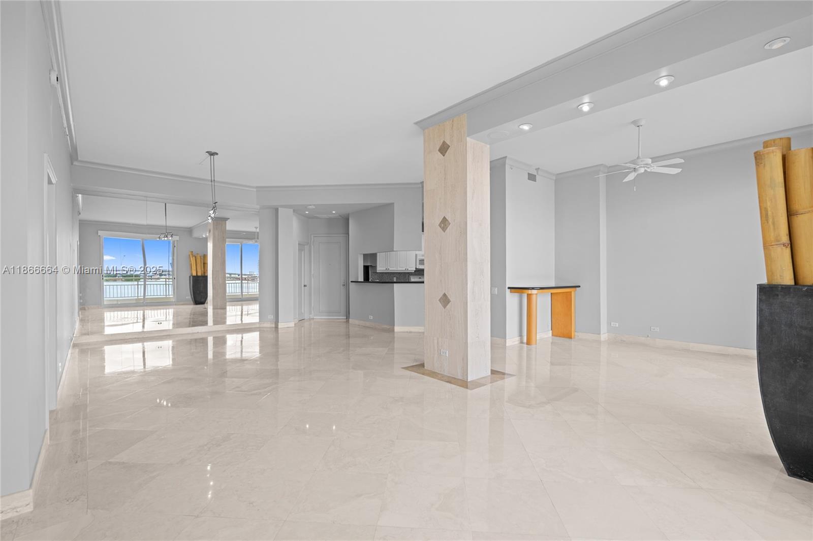 888 Brickell Key Drive, Unit 408 Miami, FL 33131 - Photo 14 of 54 a view of kitchen with refrigerator and window
