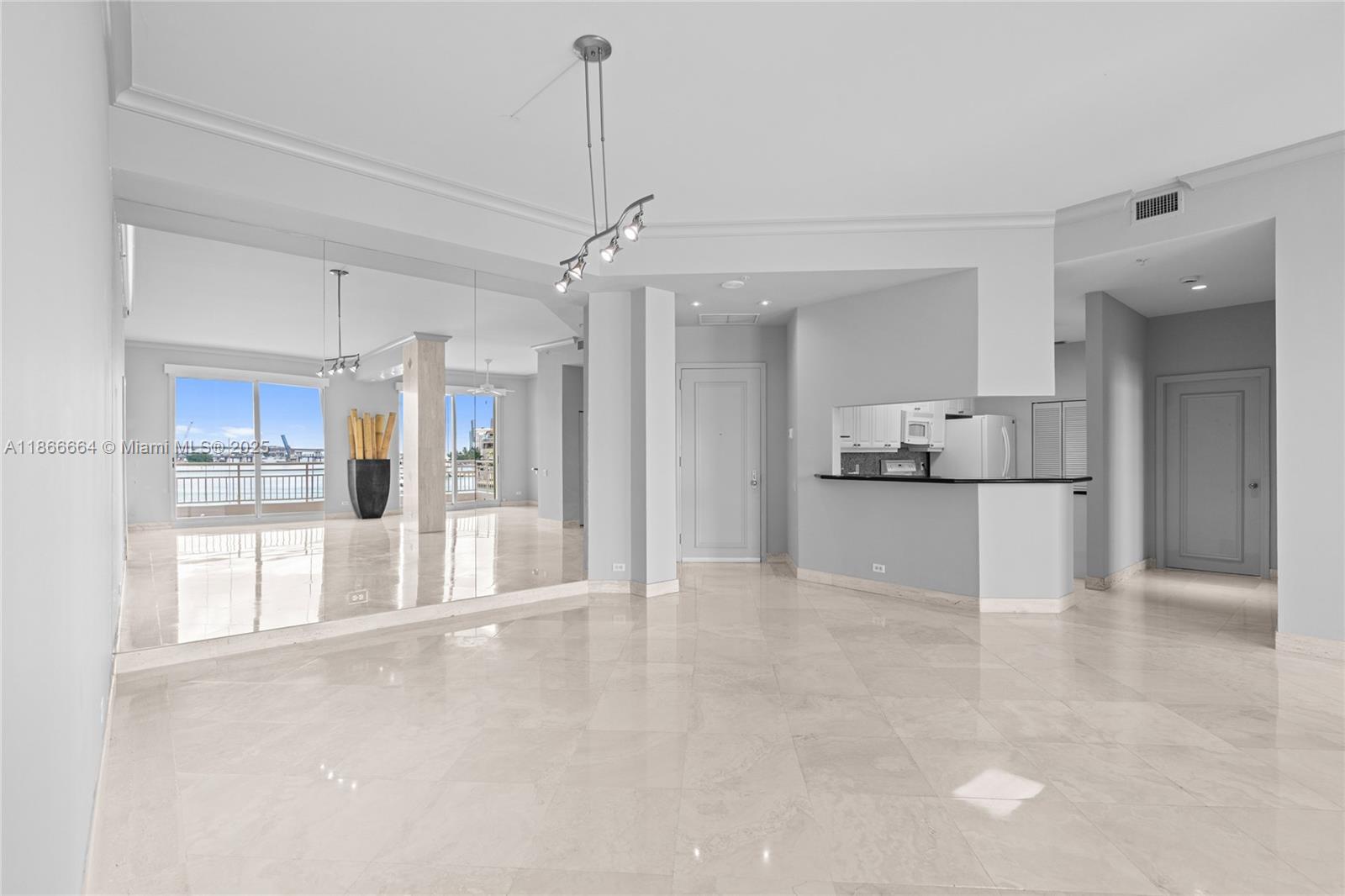 888 Brickell Key Drive, Unit 408 Miami, FL 33131 - Photo 16 of 54 a view of a kitchen with a refrigerator and a sink