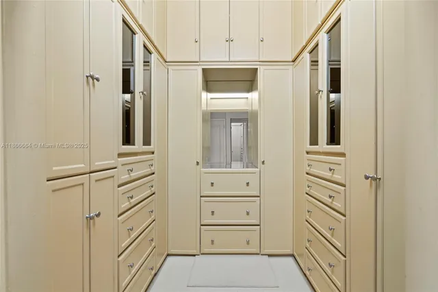 a bathroom with a double vanity sink toilet mirror and shower