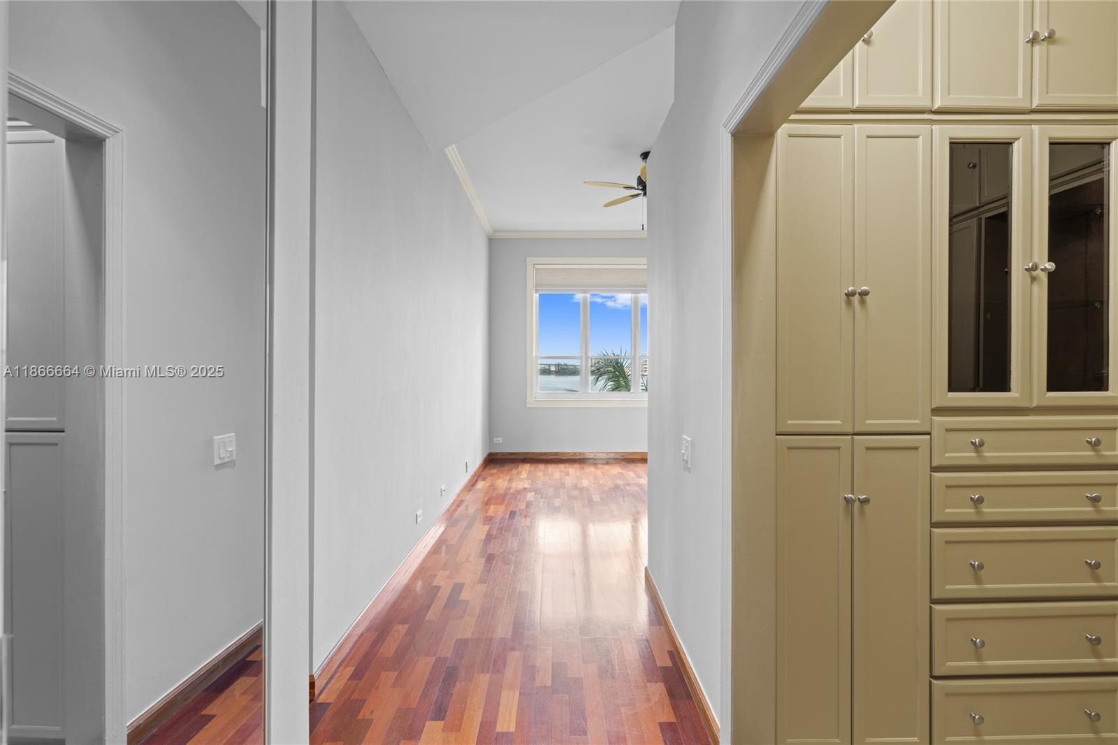 888 Brickell Key Drive, Unit 408 Miami, FL 33131 - Photo 31 of 54 a view of a hallway with wooden floor and staircase