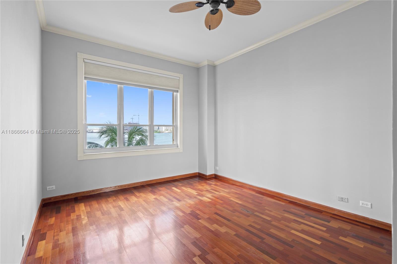 888 Brickell Key Drive, Unit 408 Miami, FL 33131 - Photo 33 of 54 an empty room with a window