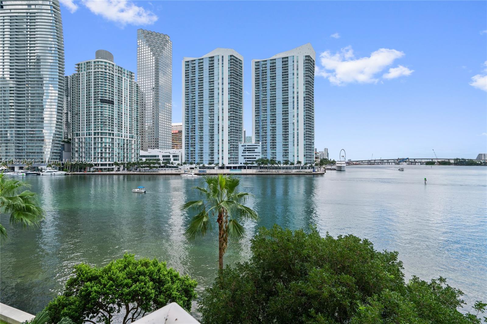 888 Brickell Key Drive, Unit 408 Miami, FL 33131 - Photo 54 of 54 a view of a lake with tall building