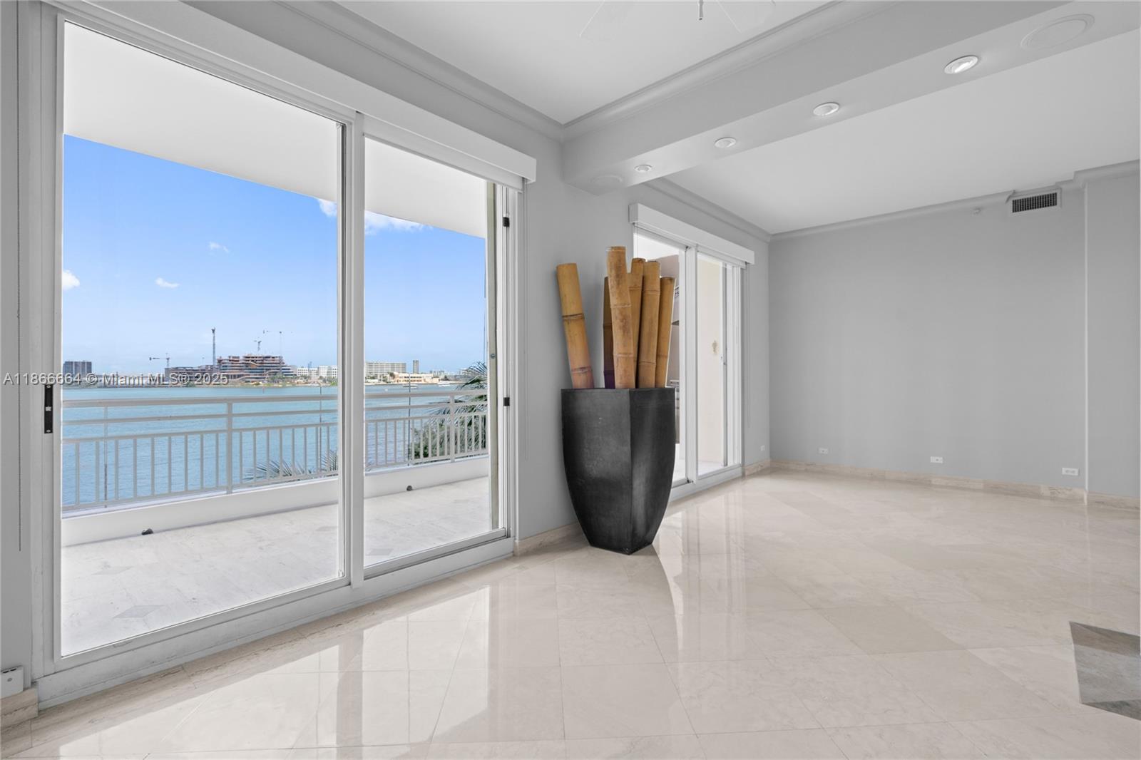 888 Brickell Key Drive, Unit 408 Miami, FL 33131 - Photo 9 of 54 a view of a glass door and an entryway