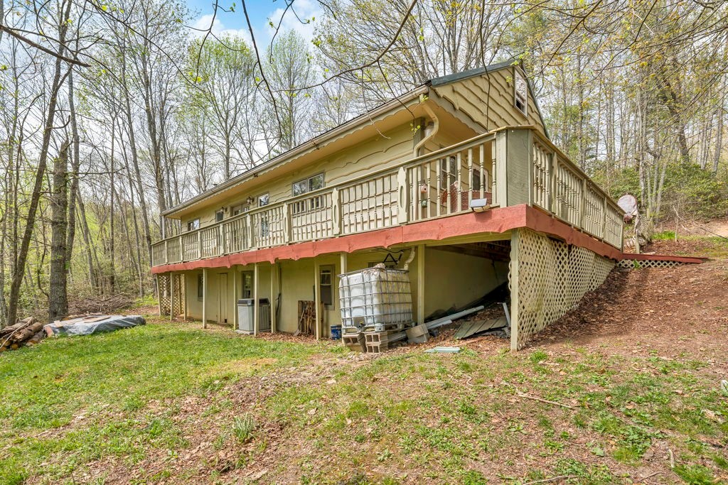 179 Soave Ridge Deep Gap, NC 28618 - Photo 2 of 31 a view of a house with a yard and wooden fence