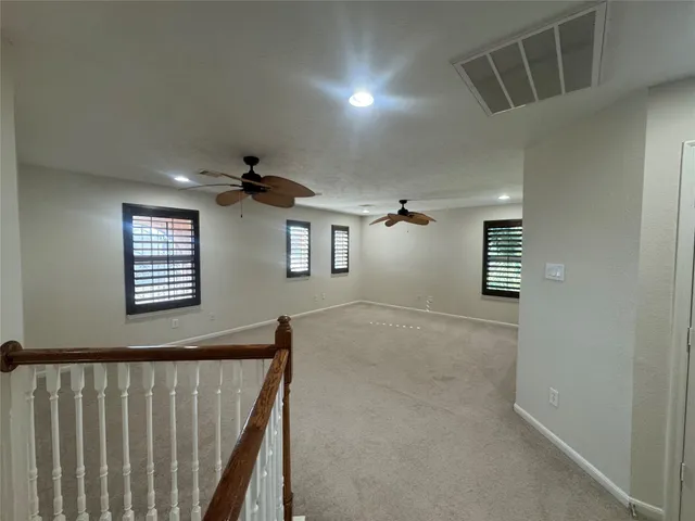 a kitchen with granite countertop a sink and steel appliances