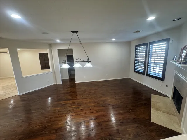a spacious bathroom with a large tub shower and sink