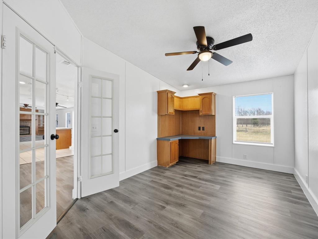 229 Morgan Road Italy, TX 76651 - Photo 12 of 40 a view of empty room with wooden floor and window