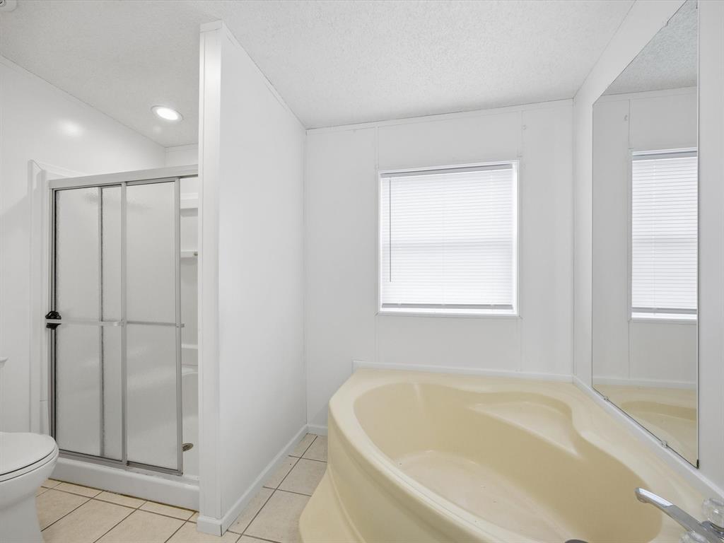 229 Morgan Road Italy, TX 76651 - Photo 16 of 40 a white bath tub sitting next to a toilet