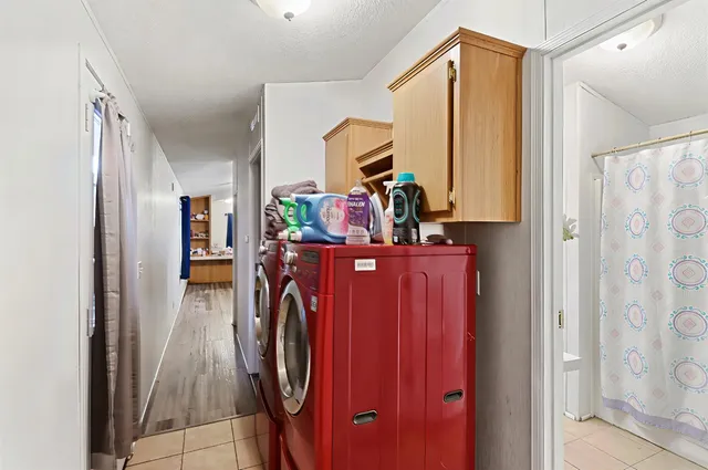 a view of a hallway with washer and dryer